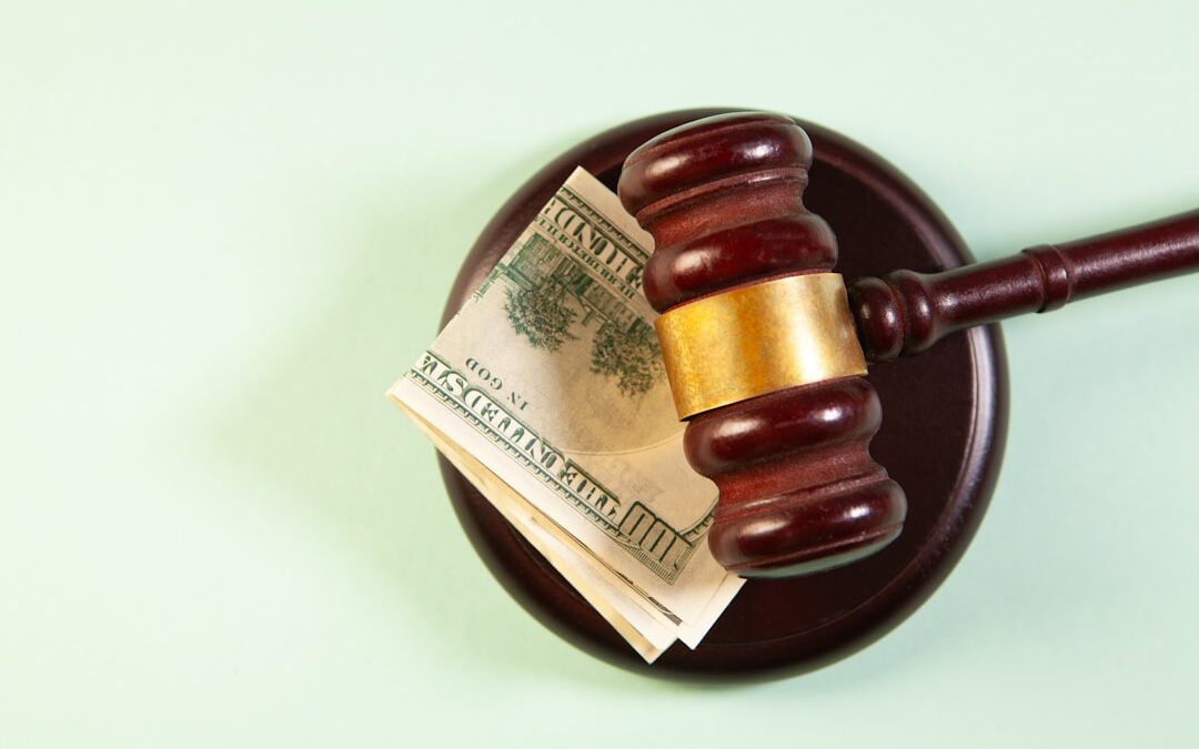 Gavel and money representing asset recovery litigation in Kenya