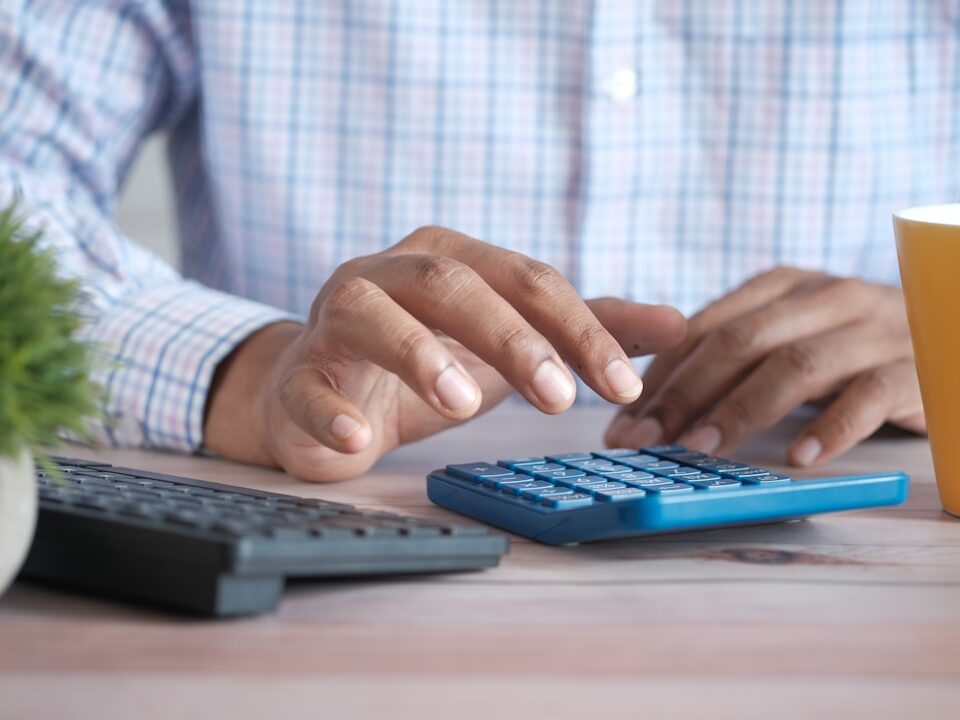 Calculator and documents representing corporate tax for Kenyan businesses