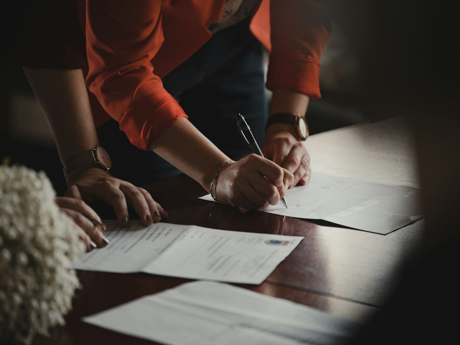 African business executive signing a share buyback agreement