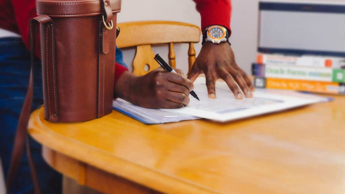 African professional reviewing bribery act compliance documents