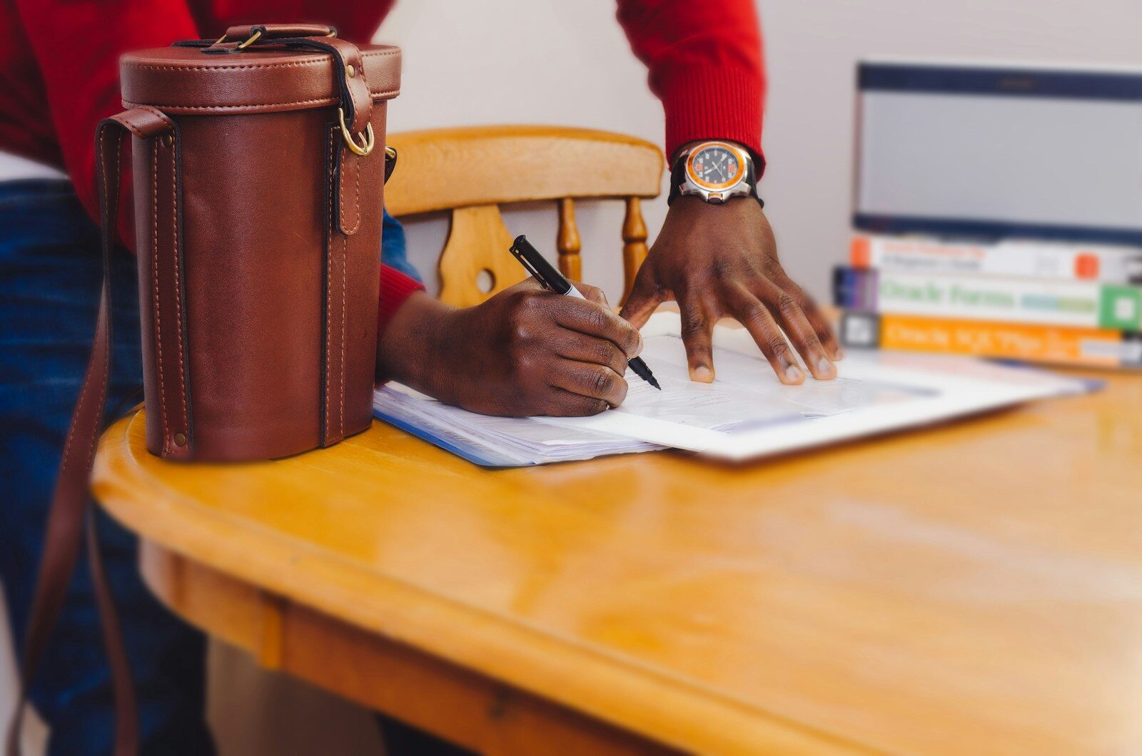 African professional reviewing bribery act compliance documents