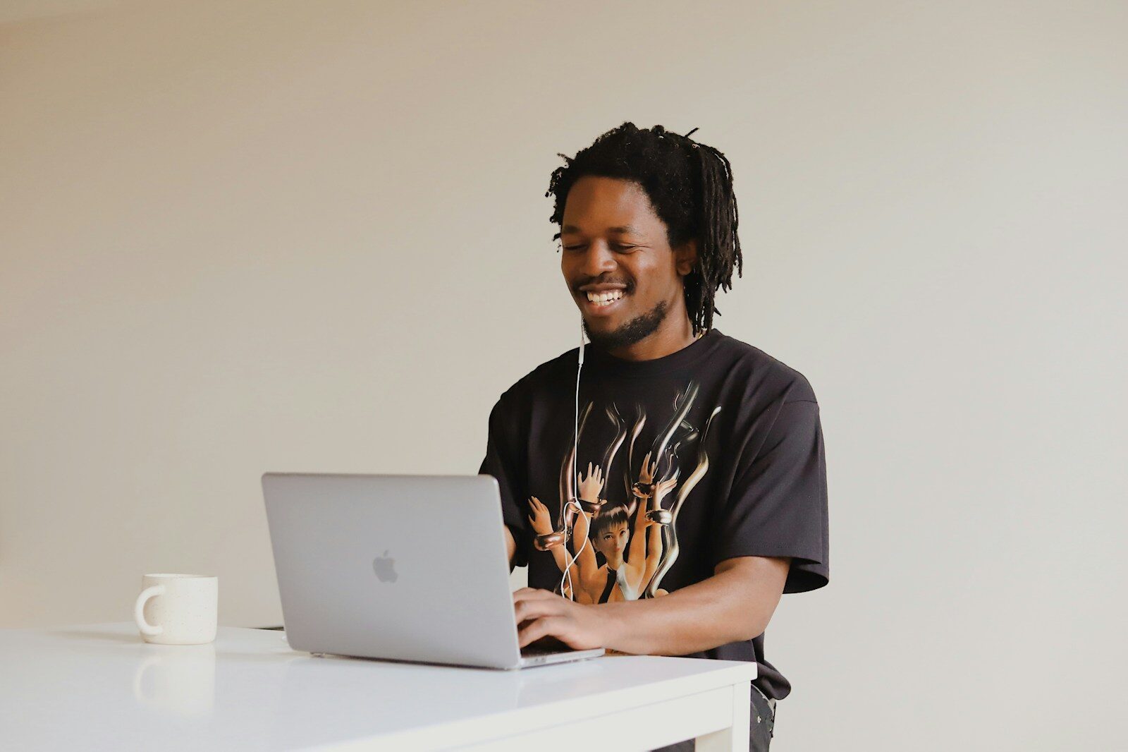 African professional using a laptop, representing a business handling domain name disputes in Kenya