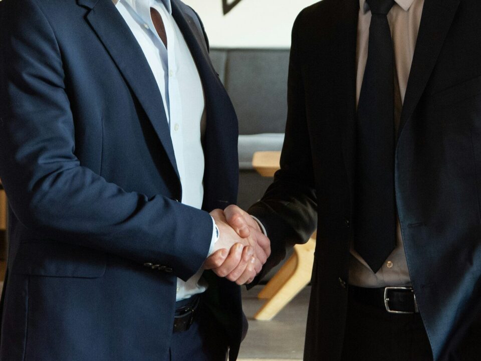 Business partners shaking hands over a distribution or agency agreement in Kenya