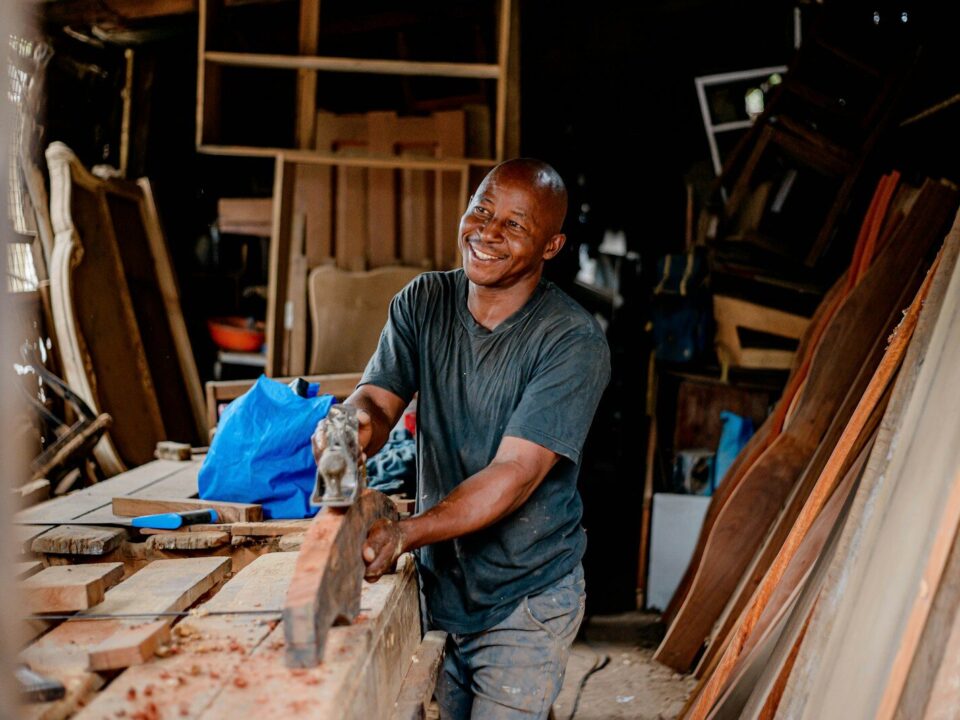 African family-owned small business craftsman at work
