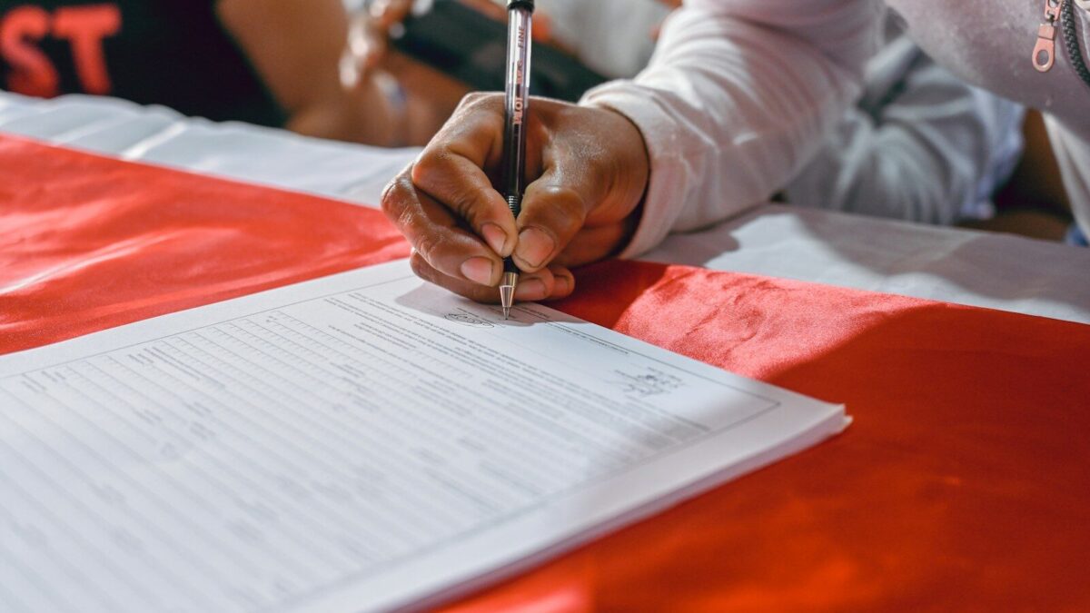African professional completing deregistration paperwork