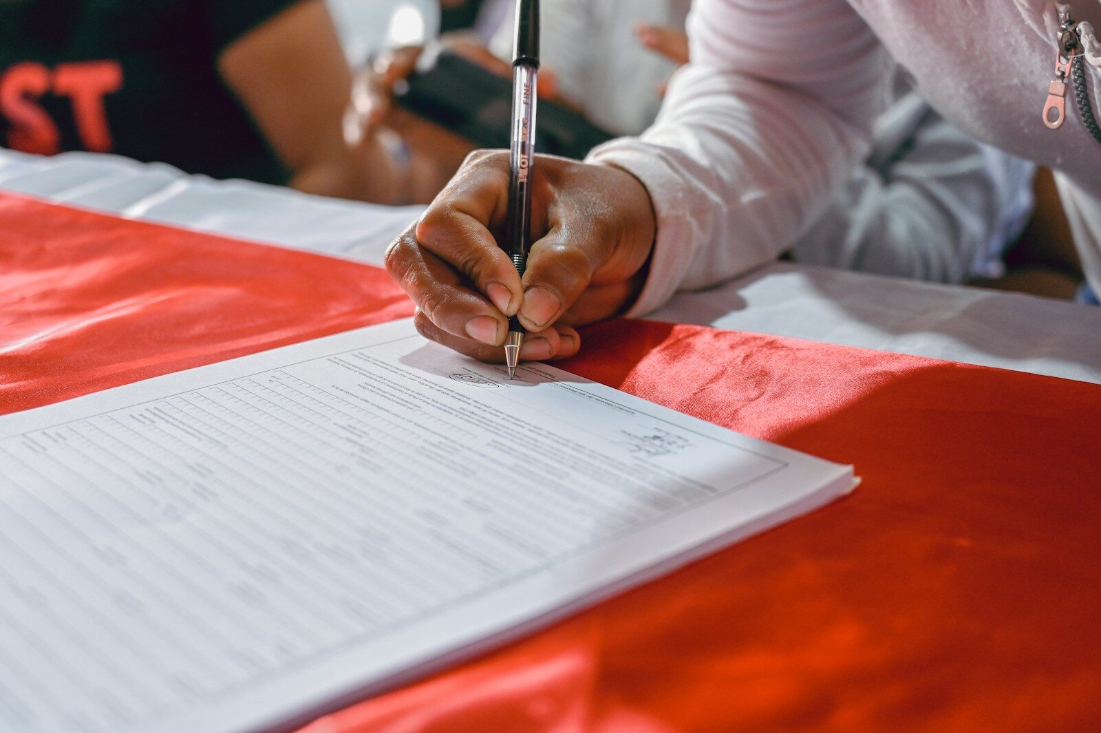African professional completing deregistration paperwork