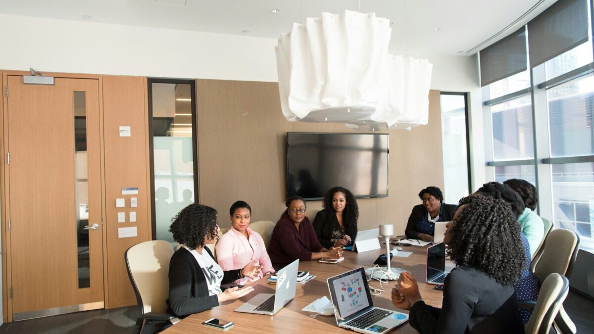 African business professionals in a meeting discussing a company voluntary arrangement