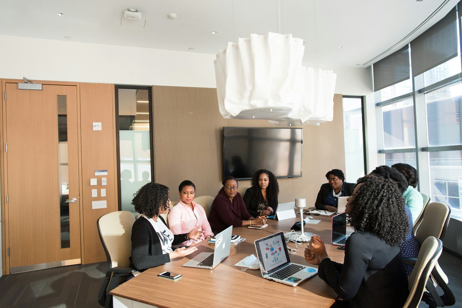 African investors reviewing documents in a meeting, illustrating IP diligence on Kenyan startup cap tables