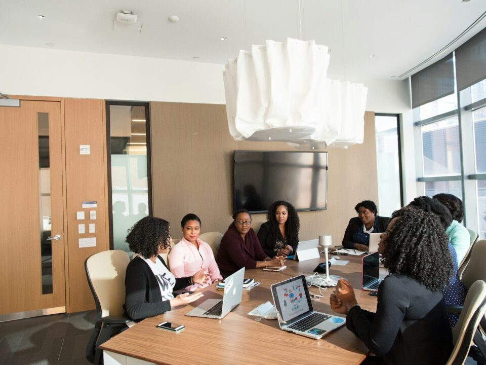 African business professionals in a meeting discussing a company voluntary arrangement