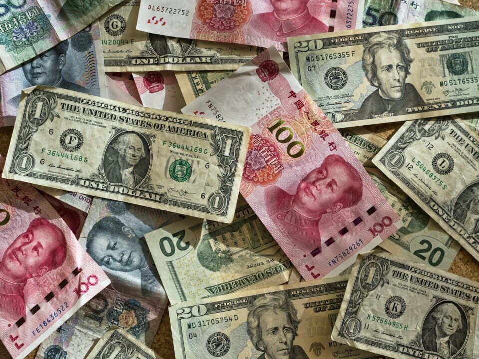 Assorted currency banknotes, representing cross-border royalty payments and withholding tax on IP licences from Kenya