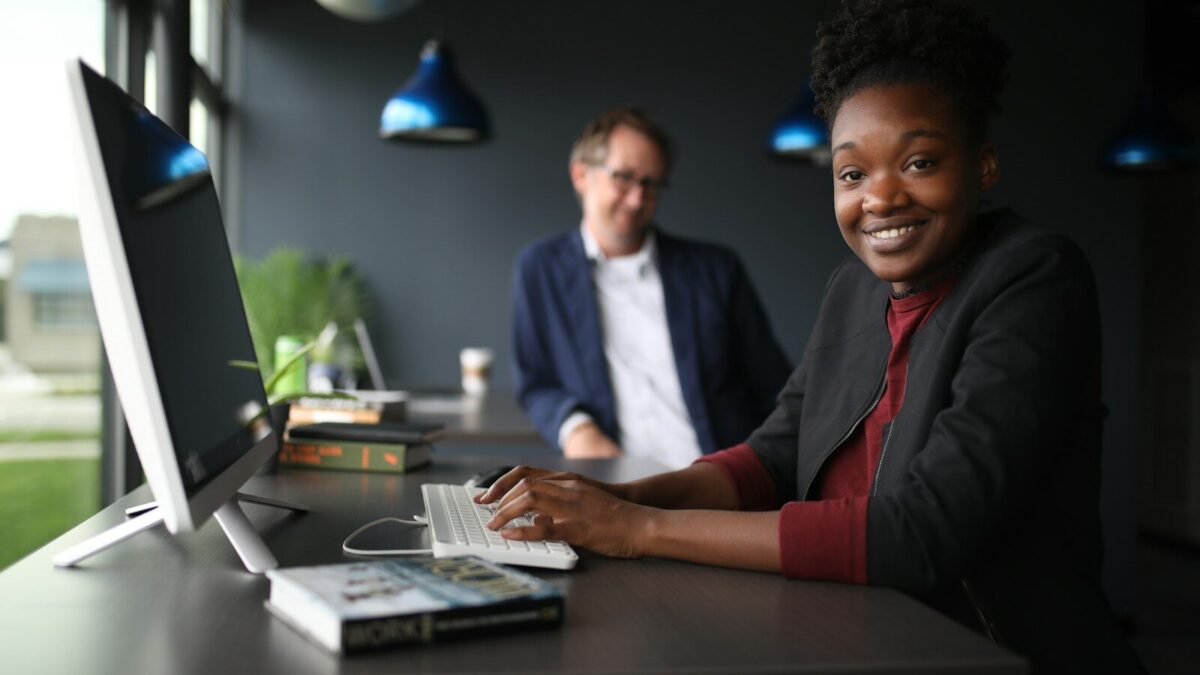 Two professionals reviewing documents at a desk, representing a foreign IP applicant working with a local Kenyan agent on a KIPI filing
