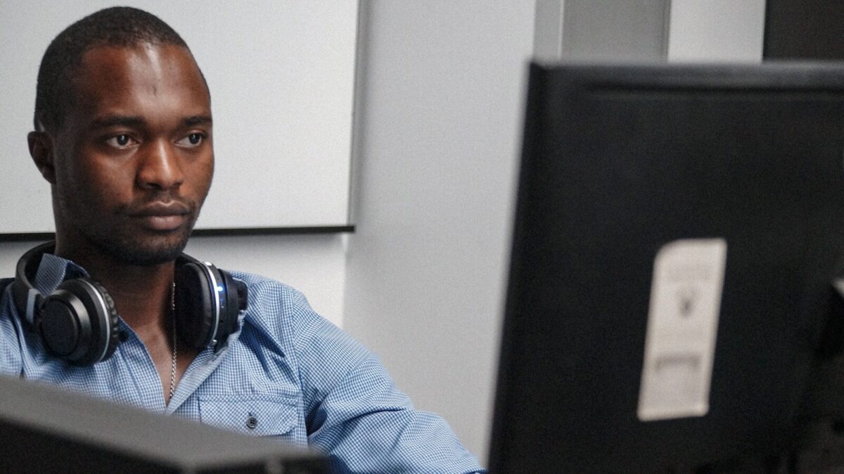 African employee at a desk, illustrating restraint of trade considerations