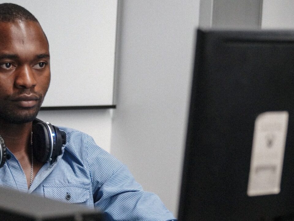 African employee at a desk, illustrating restraint of trade considerations
