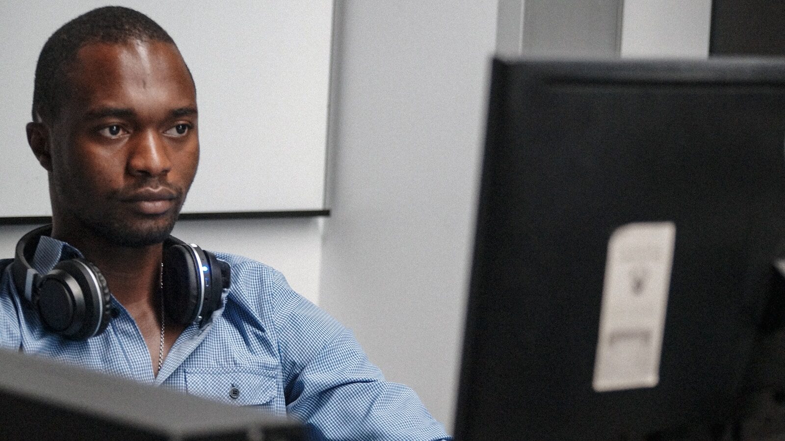 African employee at a desk, illustrating restraint of trade considerations