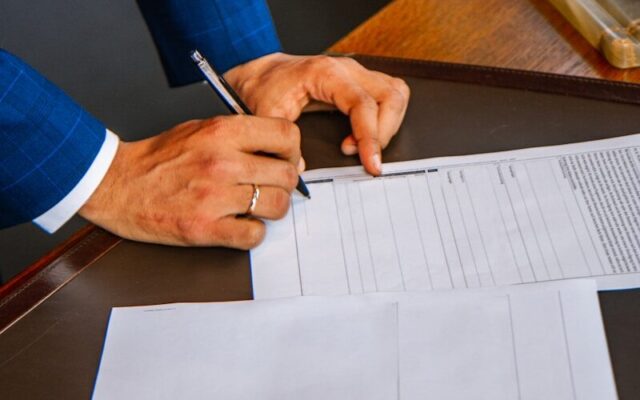 A property transaction document being signed in Kenya, subject to stamp duty