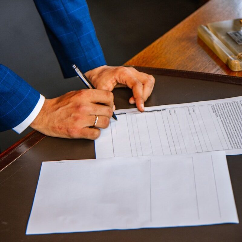 A property transaction document being signed in Kenya, subject to stamp duty
