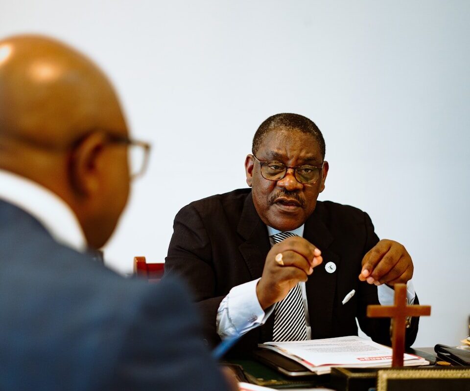 An advocate reviewing caveats and cautions on a land title document in Kenya