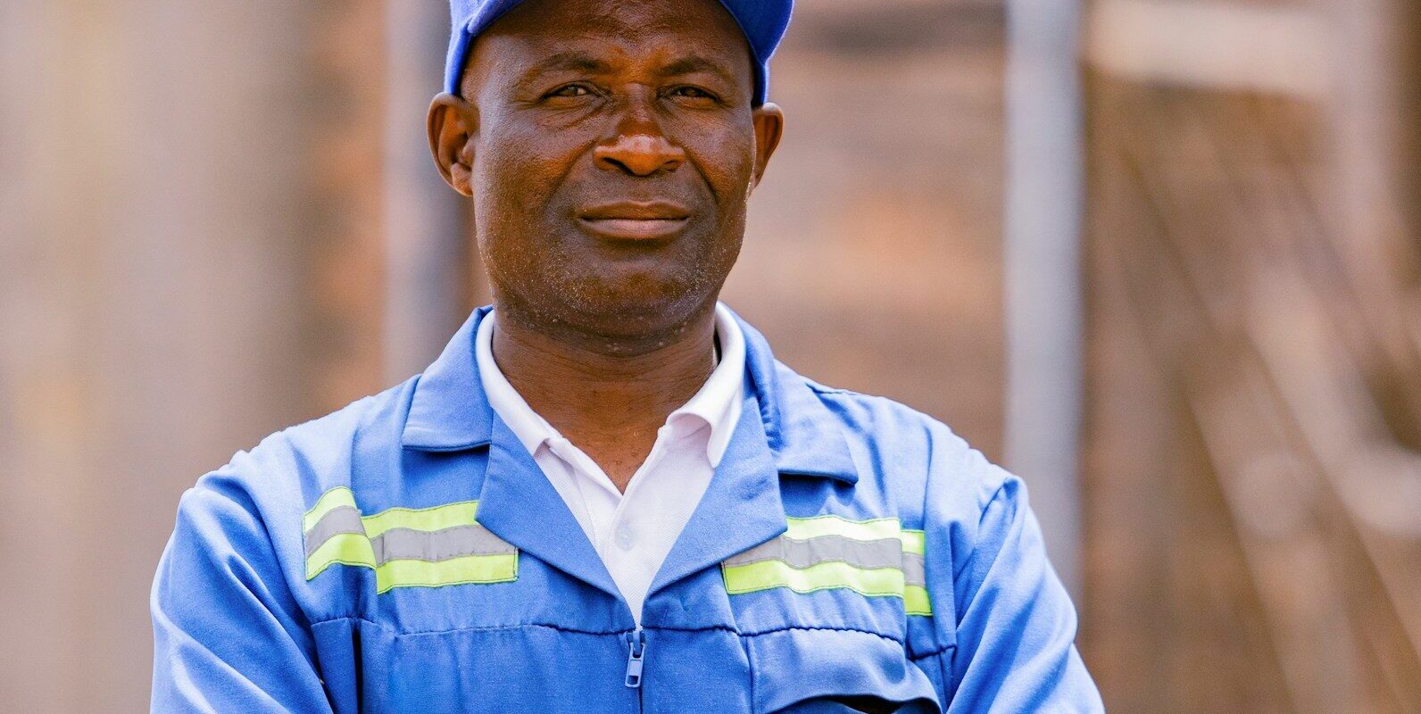 An African factory worker at a manufacturing plant, representing the kind of pharmaceutical manufacturing operations eligible for SEZ or EPZ status in Kenya