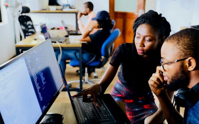 Virtual Asset Custody Obligations Kenya — African fintech professionals reviewing wallet reconciliation records on a laptop