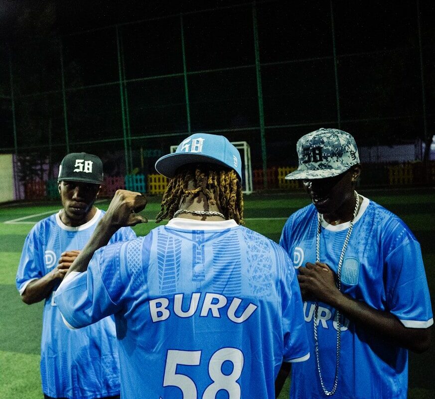 Players wearing club football jerseys, representing merchandising and sponsorship intellectual property for Kenyan sports clubs