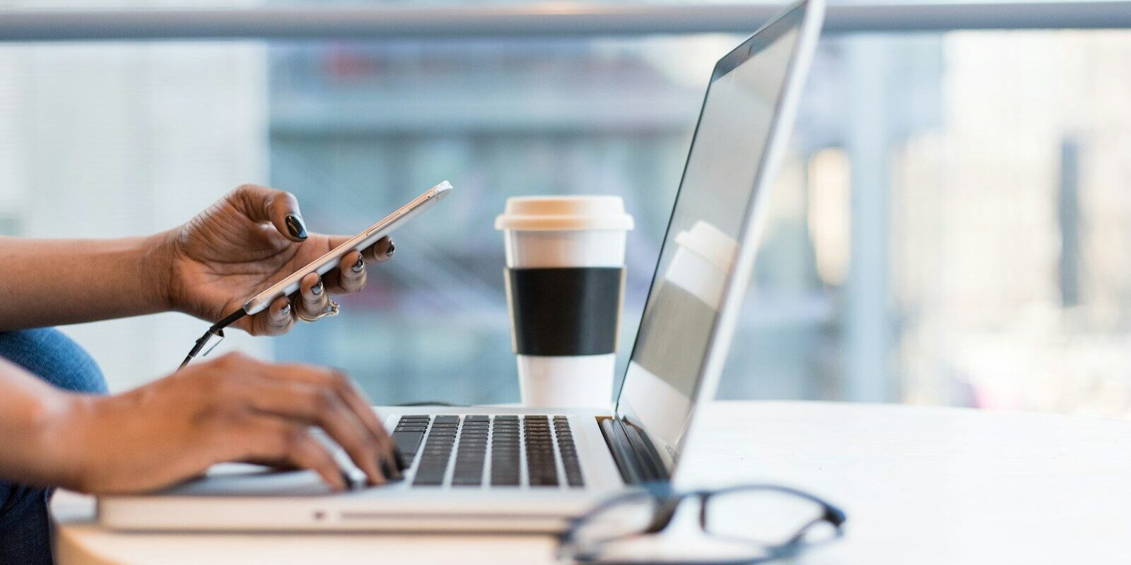 African entrepreneur reviewing documents on a laptop, representing an IP portfolio audit before a fundraise