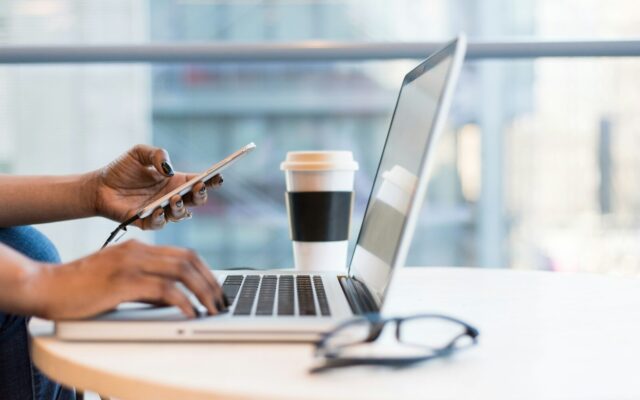 African entrepreneur reviewing documents on a laptop, representing an IP portfolio audit before a fundraise