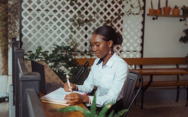 VASP Application Kenya — African professional reviewing licence application documents at a desk