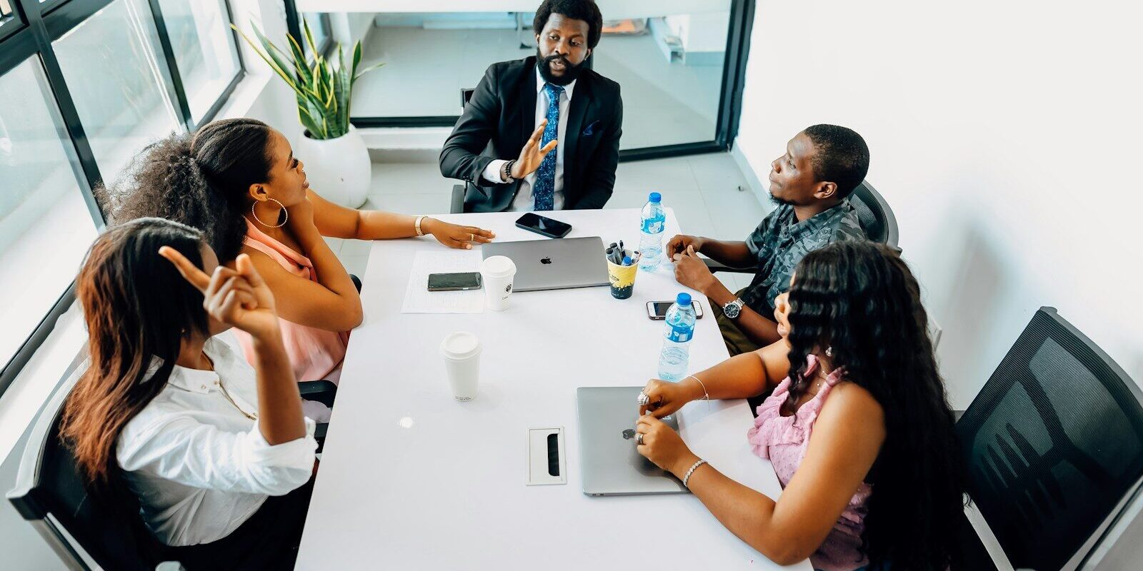 African business team in a boardroom meeting discussing compliance