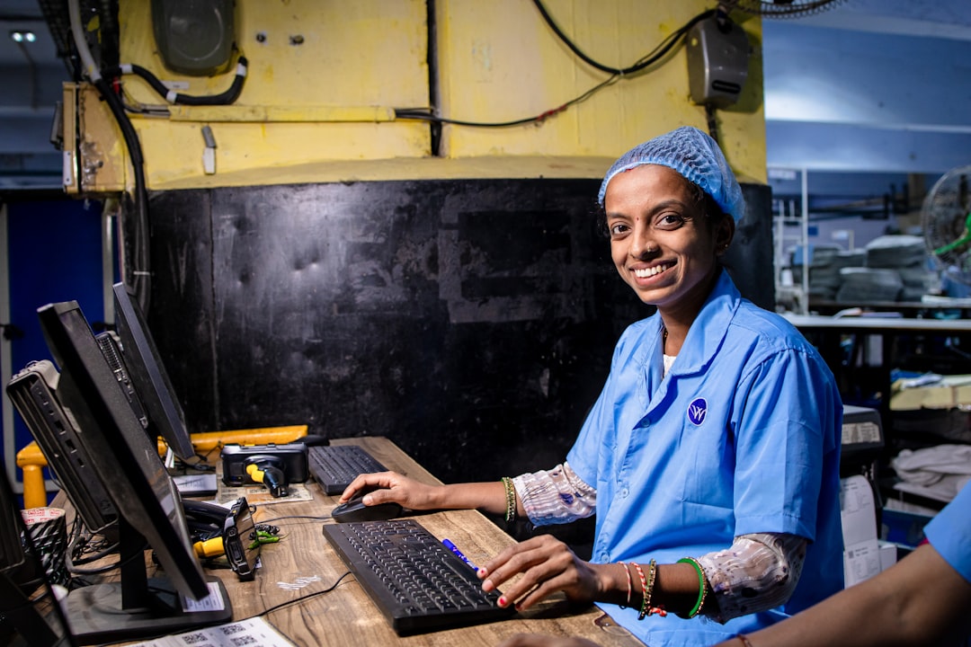 Factory worker operating equipment on an assembly line in Kenya