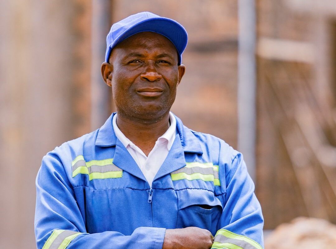 Portrait of a Kenyan factory worker in safety overalls