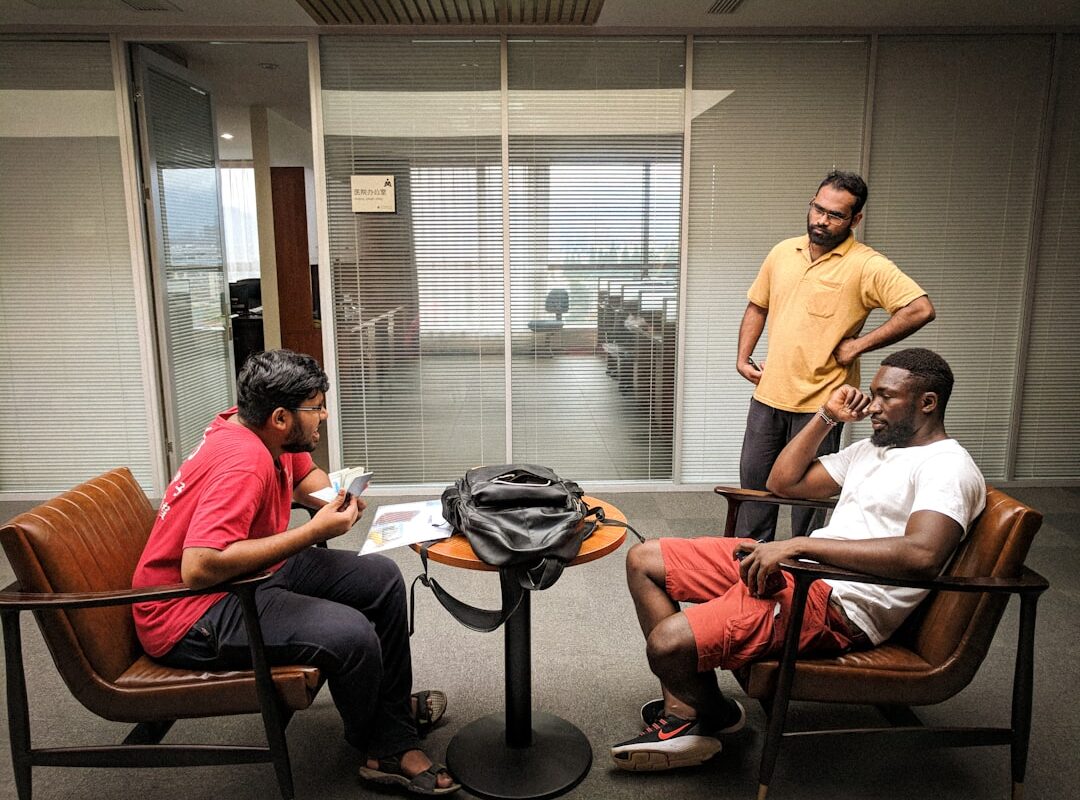 Factory workers in discussion at a manufacturing plant