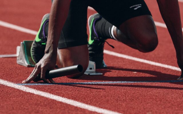 Sprinter at the starting blocks on an athletics track