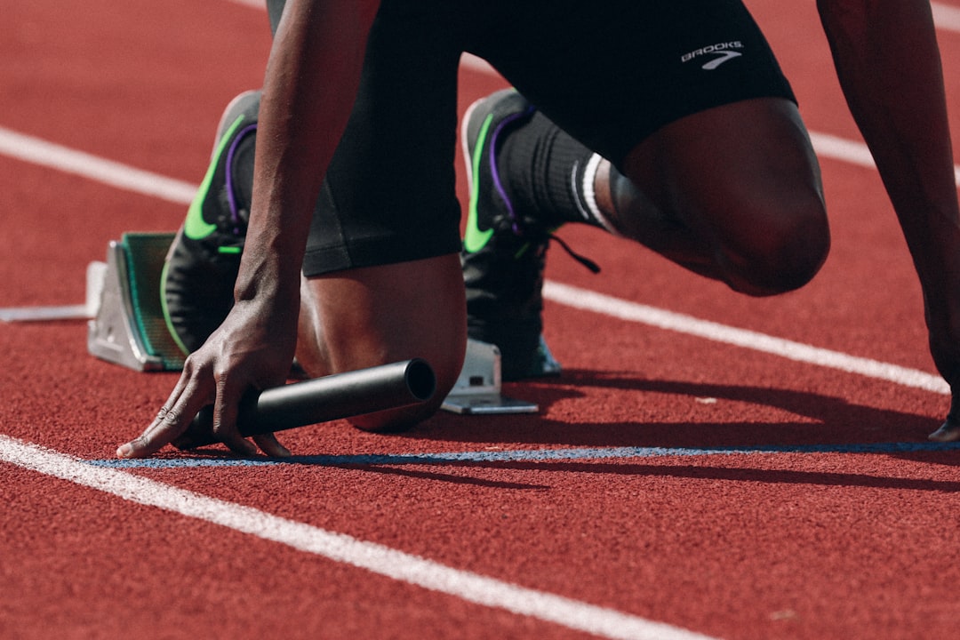 Sprinter at the starting blocks on an athletics track