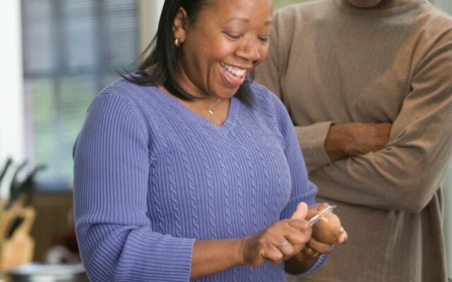 Couple at home in the kitchen, illustrating pension scheme members whose retirement savings are held in trust in Kenya