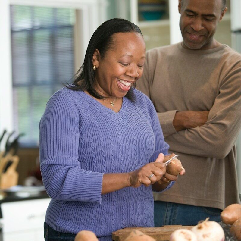 Couple at home in the kitchen, illustrating pension scheme members whose retirement savings are held in trust in Kenya