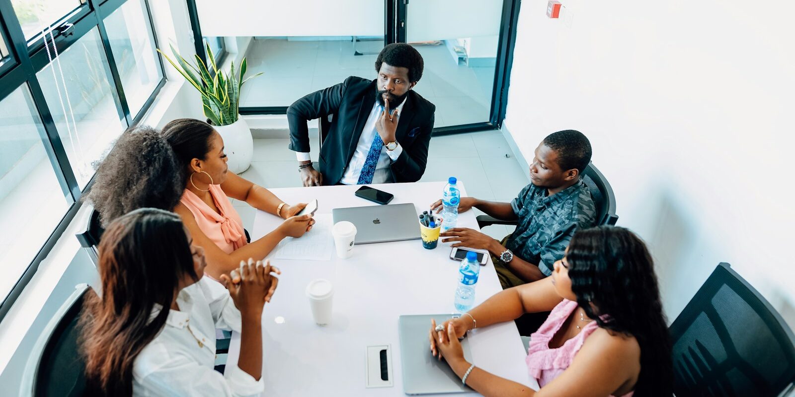 VASP change of control: African directors and investors around a boardroom table discussing a share transfer