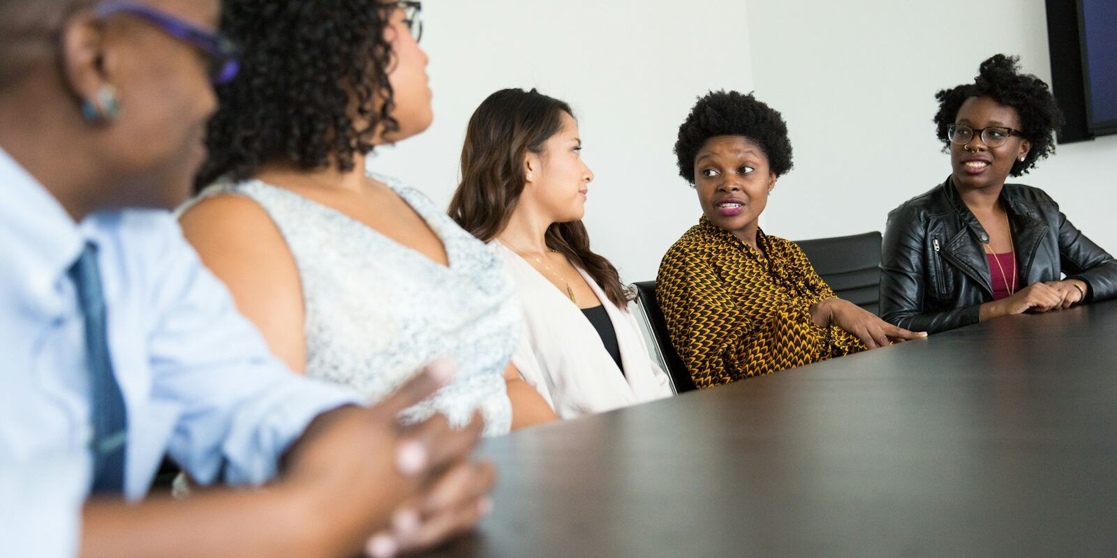 African professionals in a boardroom discussing anti-bribery procedures in Kenya for a foreign-owned subsidiary