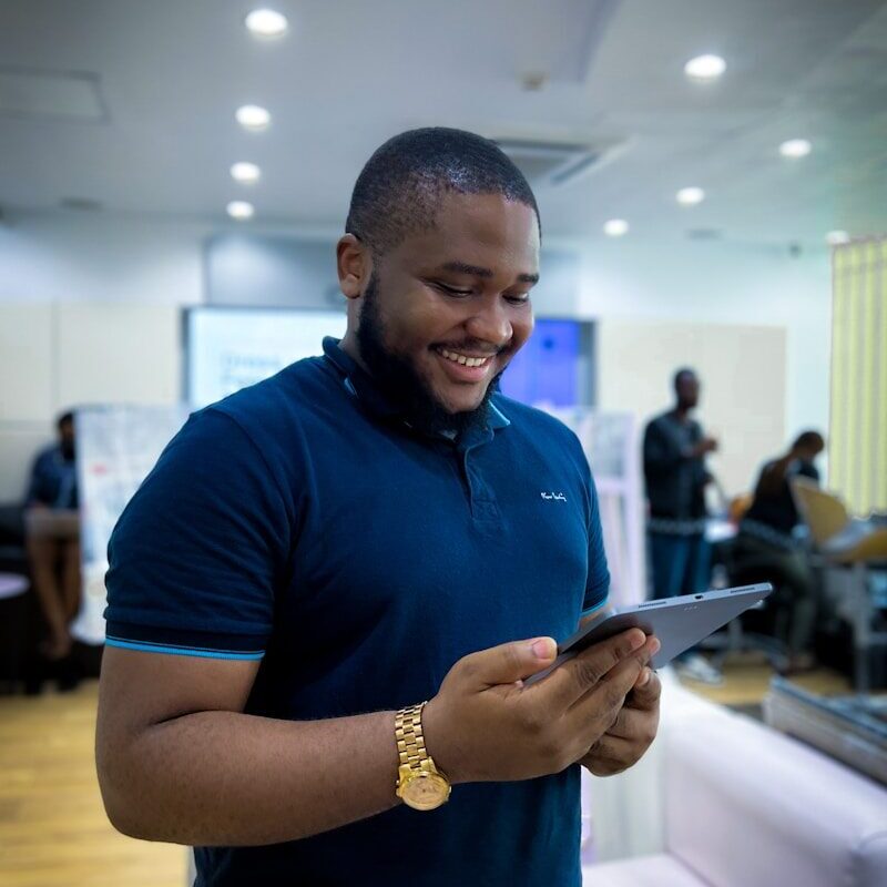 Stablecoin Issuance Kenya — African fintech professional reviewing a digital currency platform on a tablet
