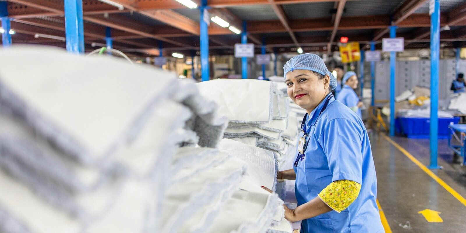 African pharmaceutical factory worker on a manufacturing production line in Kenya