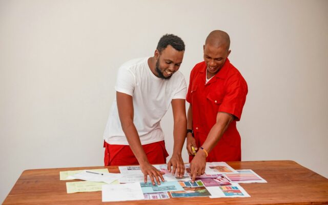 Two colleagues reviewing documents together at a table