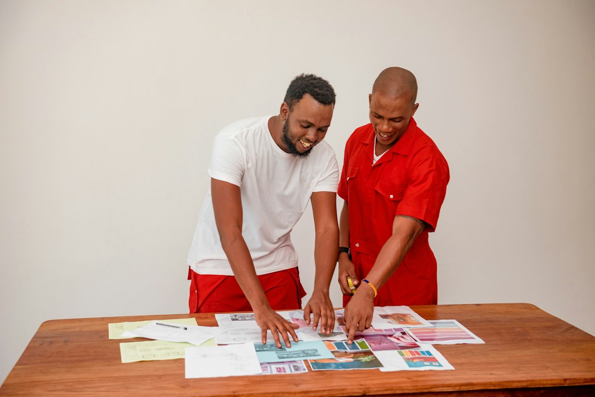 Two colleagues reviewing documents together at a table