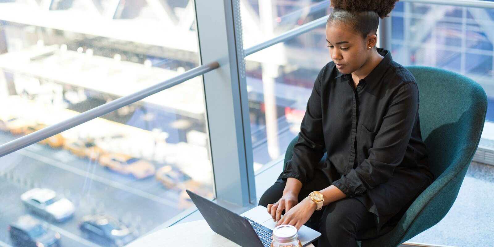 Enterprise professional reviewing a colocation services agreement on a laptop in a high-rise office, representing data centre contract negotiation in Kenya
