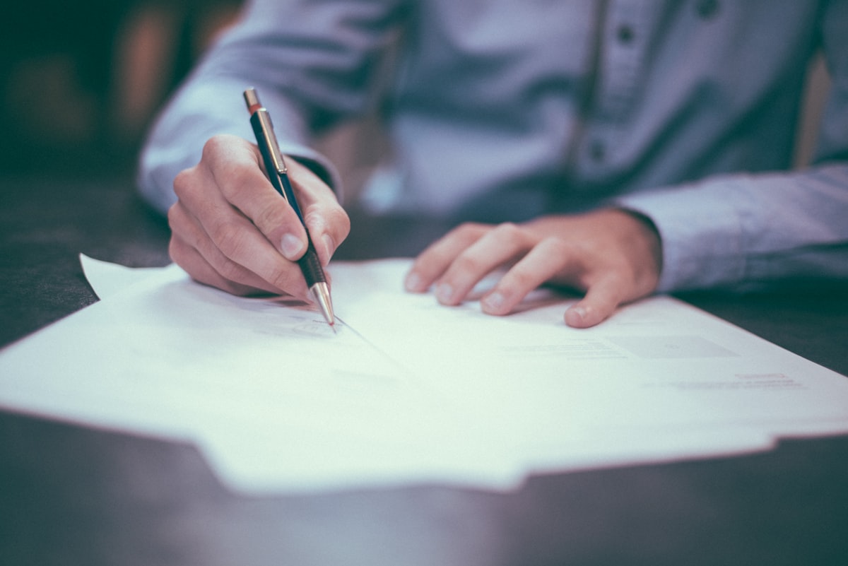 A director writing and signing a company document