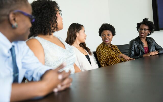 A group of colleagues discussing business at a table