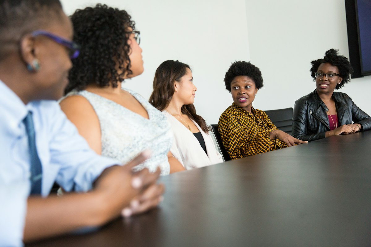 A group of colleagues discussing business at a table