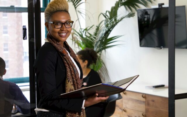 African businesswoman in an office, representing a life sciences investor planning an exit in Kenya