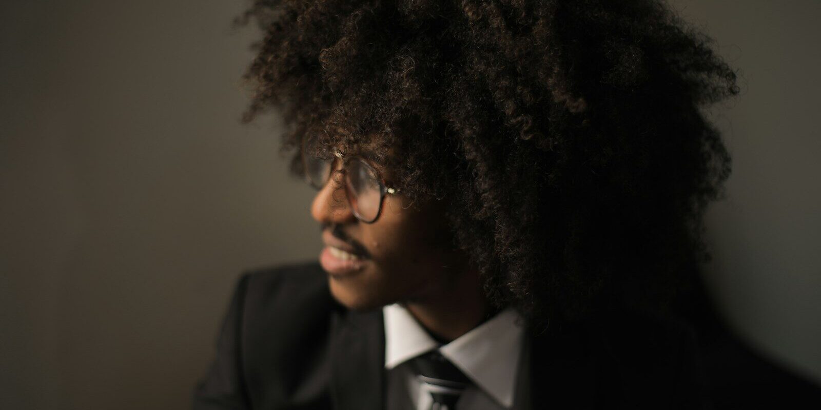 Patent annuities at KIPI: young African professional in a suit, representing an inventor or owner managing patent maintenance fees