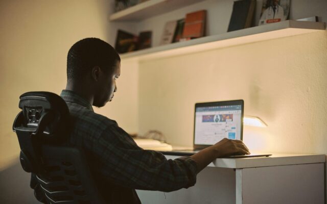 Kenyan lender reviewing a security right registration on a laptop at the E-Collateral Registry