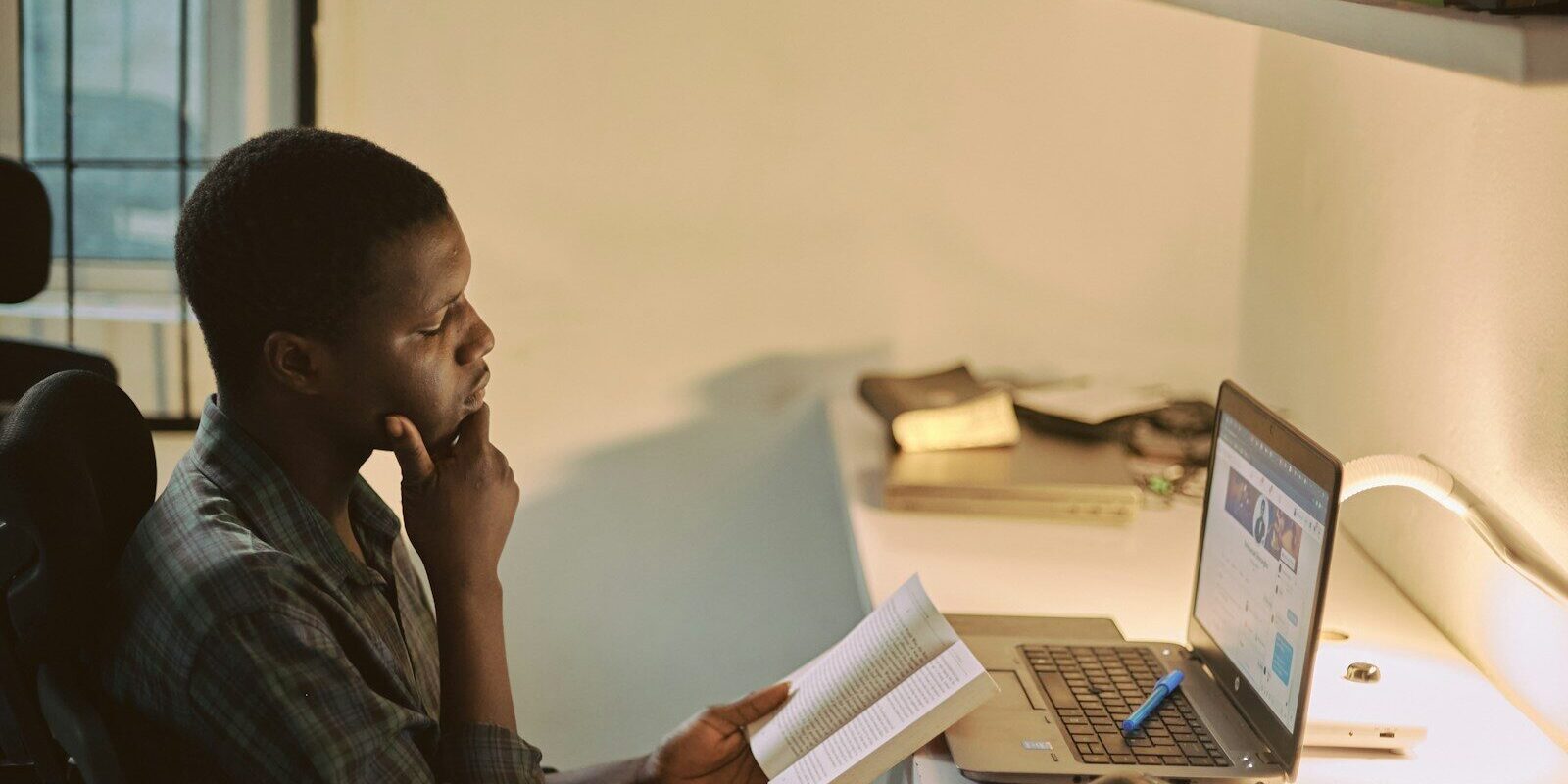 Kenyan employee holding a resignation letter in the office