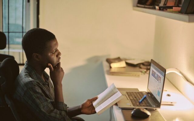 Kenyan employee holding a resignation letter in the office